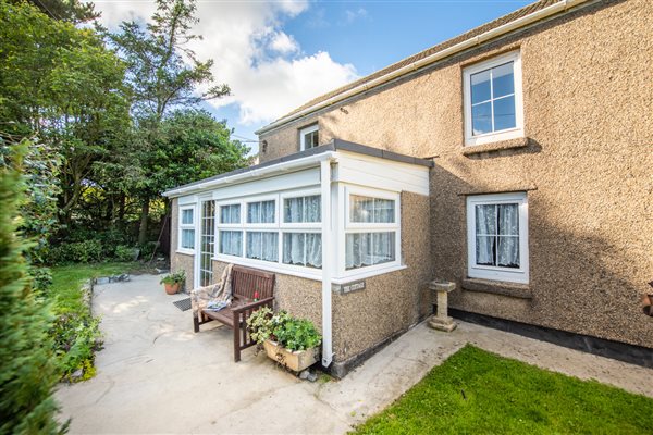 EXTERIOR OF THE COTTAGE